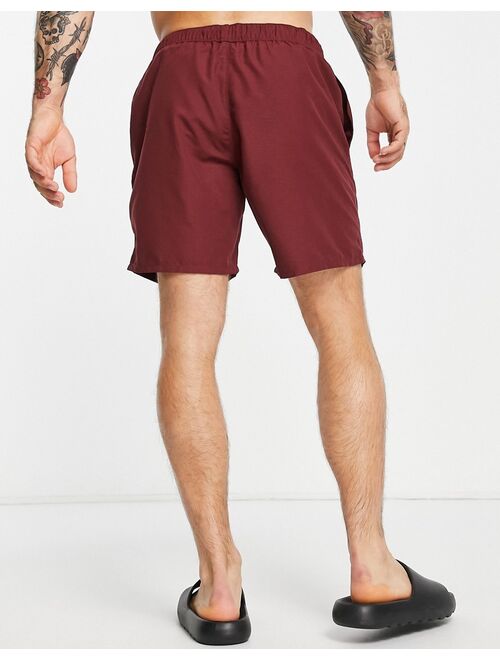 ASOS DESIGN swim shorts in burgundy