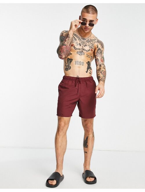 ASOS DESIGN swim shorts in burgundy