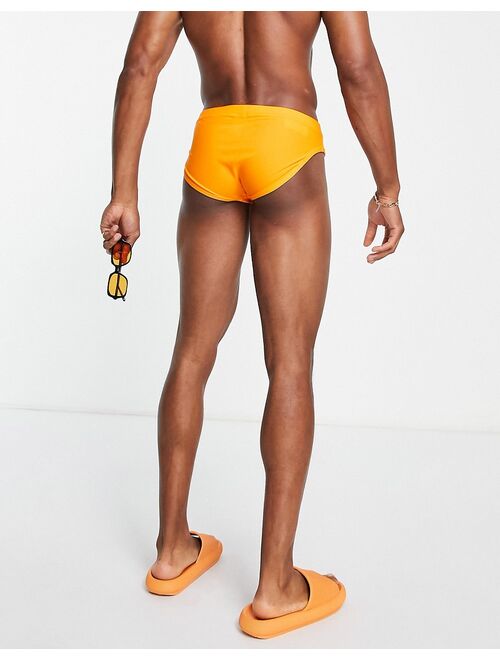 ASOS DESIGN swim briefs in bright orange