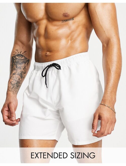 ASOS DESIGN swim shorts in white in mid length