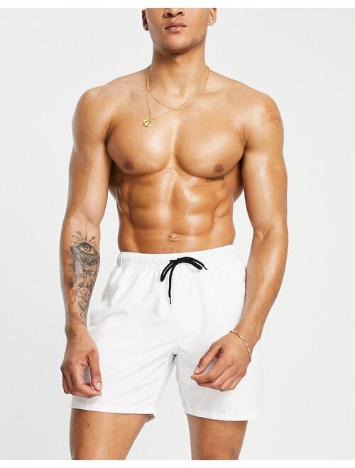 ASOS DESIGN swim shorts in white in mid length