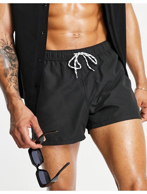 ASOS DESIGN swim shorts in black short length