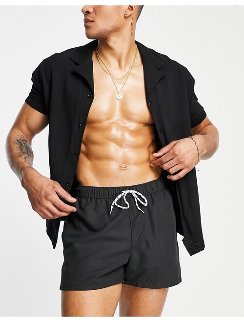 ASOS DESIGN swim shorts in black short length