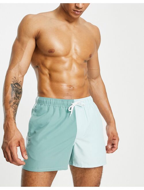 ASOS DESIGN swim shorts in color block green