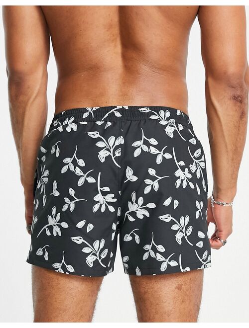 ASOS DESIGN swim shorts with scribble floral print in black short length