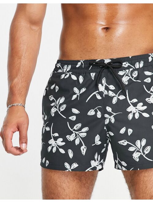 ASOS DESIGN swim shorts with scribble floral print in black short length