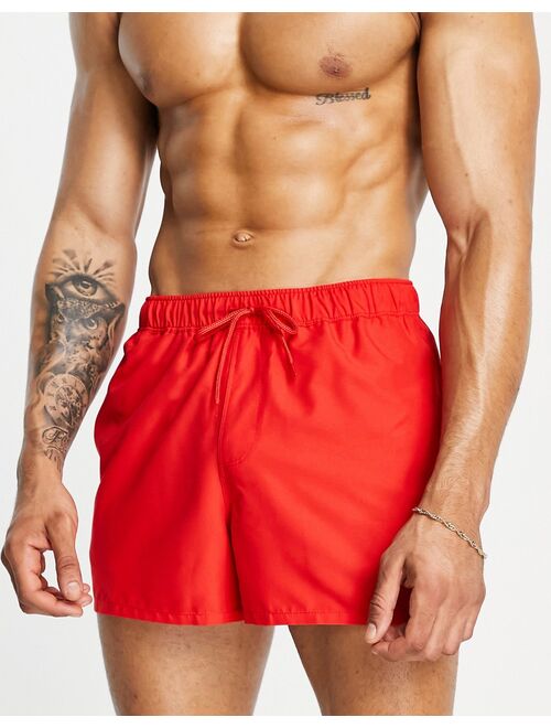 ASOS DESIGN short length swim shorts in red