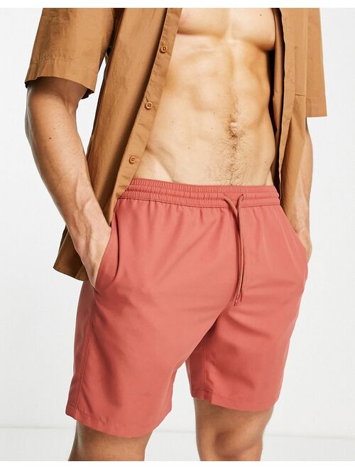 ASOS DESIGN swim shorts in rust red mid length