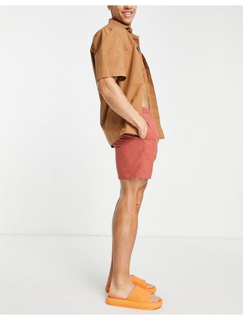 ASOS DESIGN swim shorts in rust red mid length