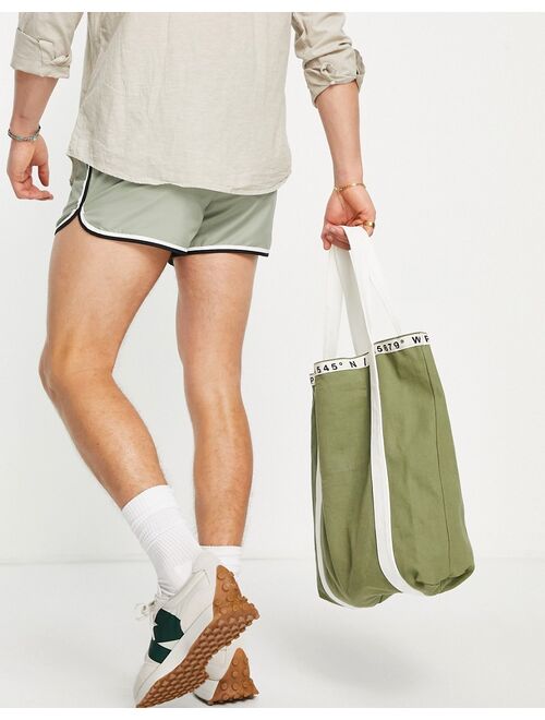 ASOS DESIGN runner swim shorts in green with contrast binding