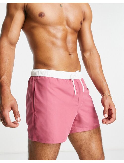 ASOS DESIGN swim shorts in pink with white tipping short length