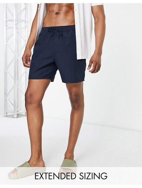 ASOS DESIGN swim shorts in navy mid length