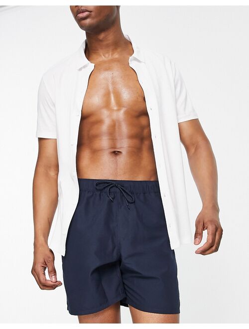 ASOS DESIGN swim shorts in navy mid length