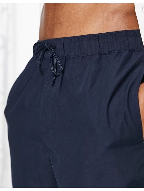 ASOS DESIGN swim shorts in navy mid length