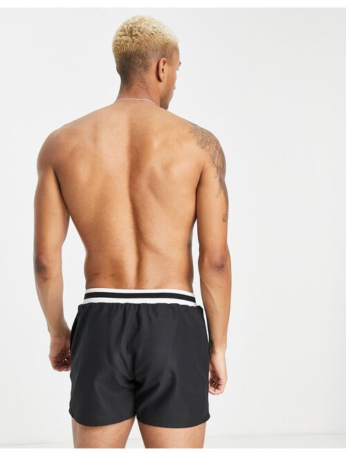 ASOS DESIGN swim shorts with contrast waistband in black short length