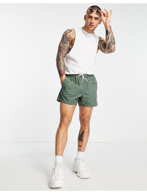 ASOS DESIGN swim shorts with acid wash and collegiate print in short length