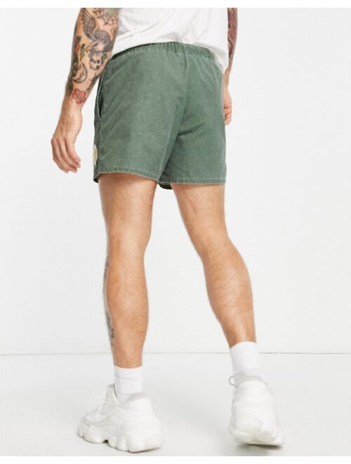 ASOS DESIGN swim shorts with acid wash and collegiate print in short length