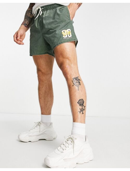 ASOS DESIGN swim shorts with acid wash and collegiate print in short length