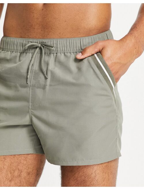 ASOS DESIGN swim shorts in khaki with tipping