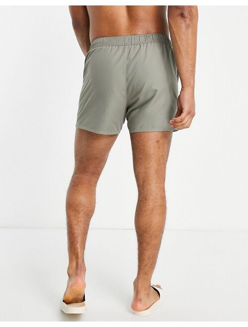 ASOS DESIGN swim shorts in khaki with tipping