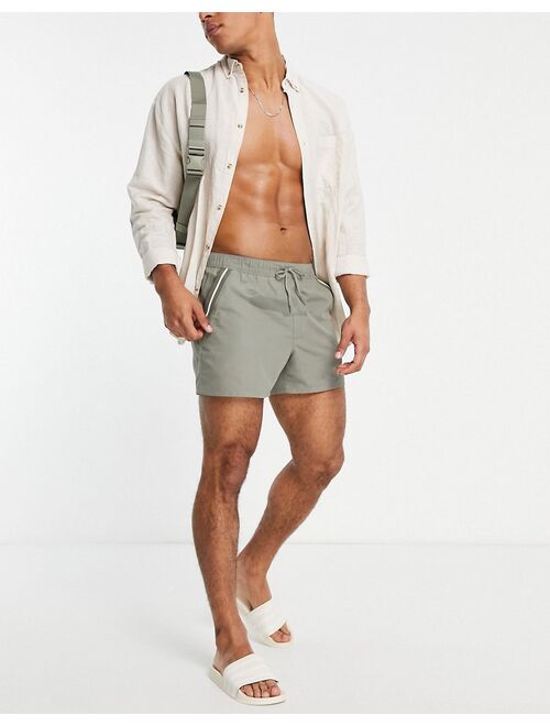 ASOS DESIGN swim shorts in khaki with tipping