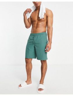 swim shorts in dark green long length