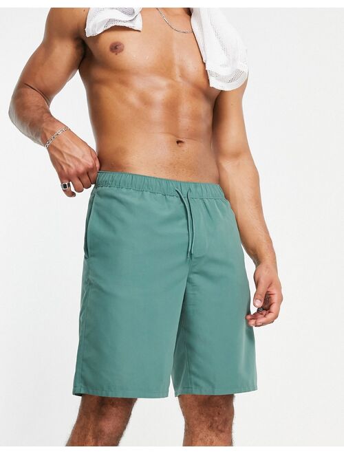 ASOS DESIGN swim shorts in dark green long length