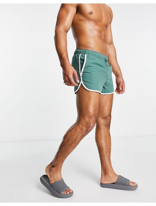 ASOS DESIGN runner swim shorts with toggle and contrast binding in green