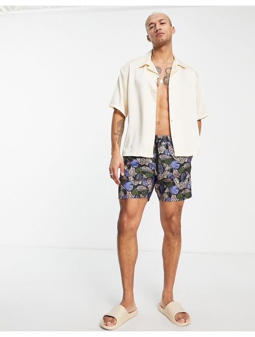 ASOS DESIGN swim shorts with leaf print mid length