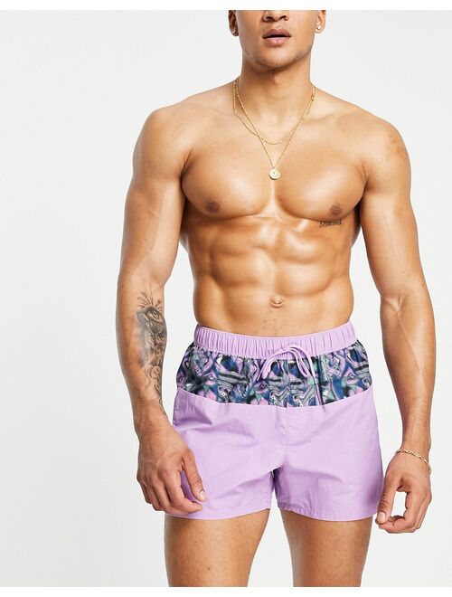 ASOS DESIGN swim shorts in purple acid wash with pattern