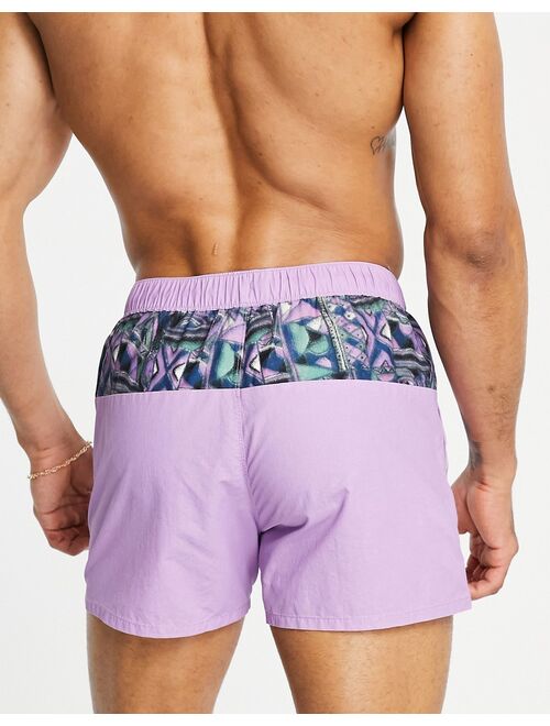 ASOS DESIGN swim shorts in purple acid wash with pattern