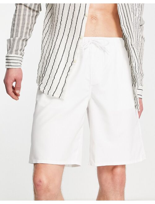 ASOS DESIGN swim shorts in white long length