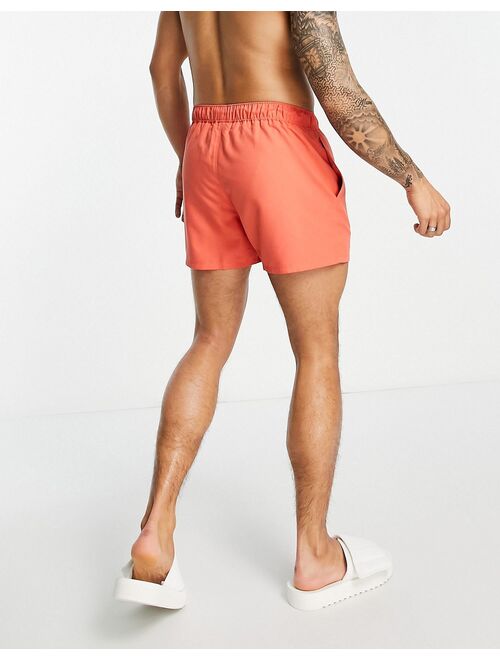 ASOS DESIGN short length swim shorts with toggle in red