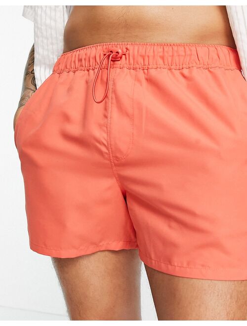 ASOS DESIGN short length swim shorts with toggle in red