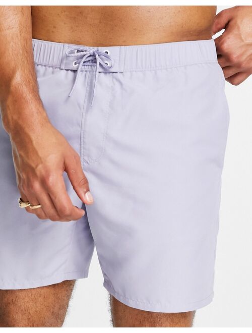 ASOS DESIGN swim shorts in light blue with eyelets in mid length