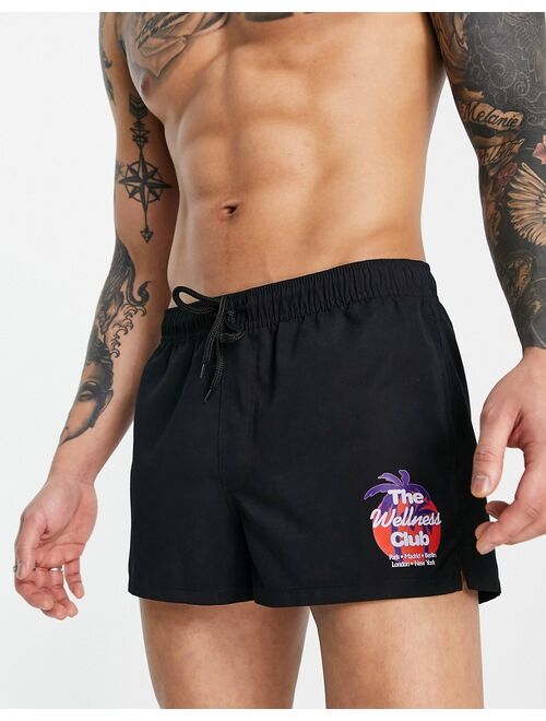 ASOS DESIGN swim shorts with badging in black super short length