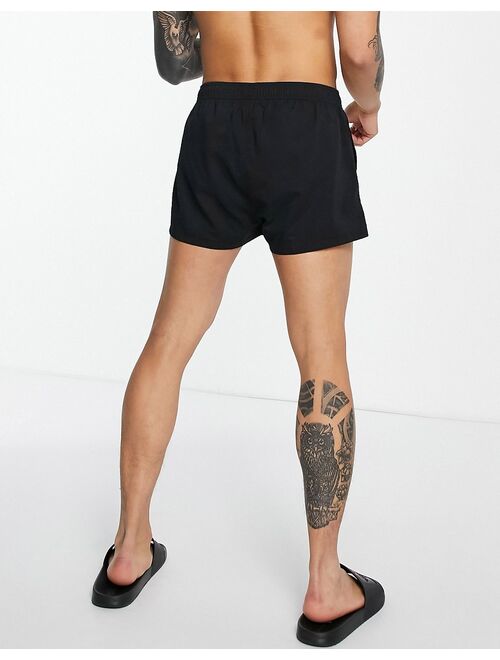 ASOS DESIGN swim shorts with badging in black super short length