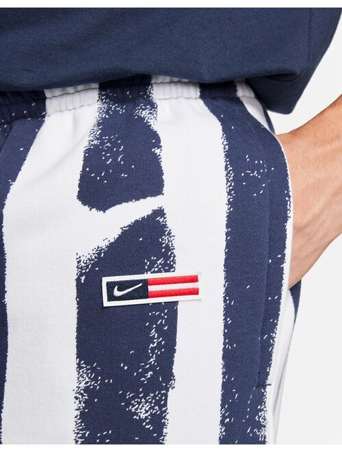 Nike RWD Pack stripe cargo shorts in navy/white