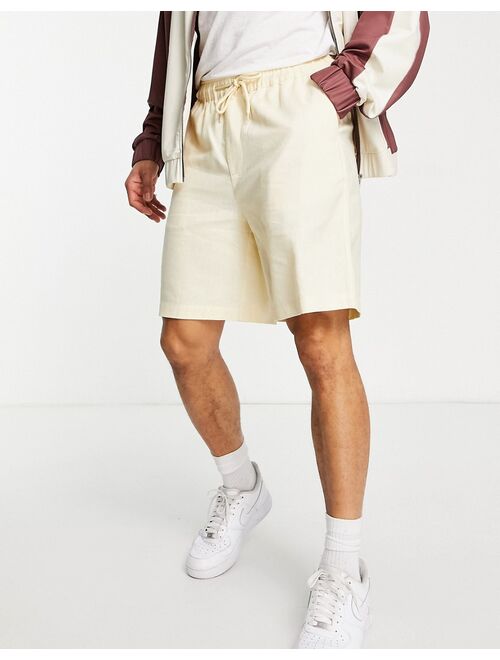 ASOS DESIGN linen boxy shorts in pastel yellow