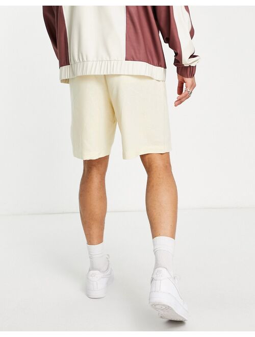 ASOS DESIGN linen boxy shorts in pastel yellow