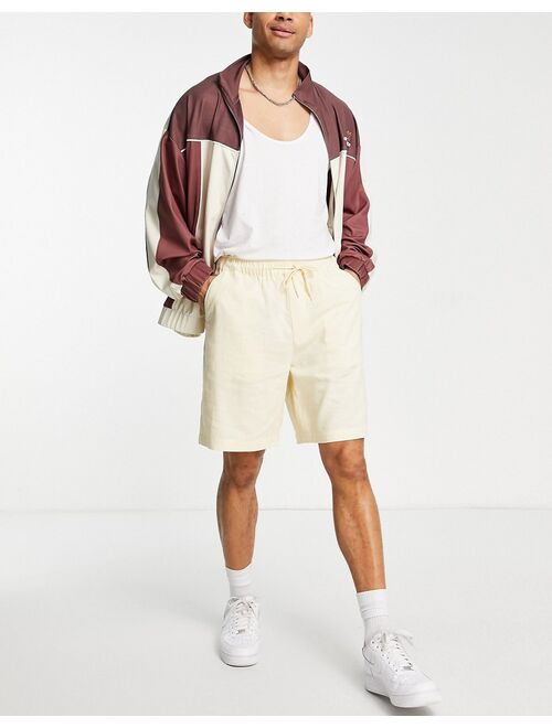 ASOS DESIGN linen boxy shorts in pastel yellow