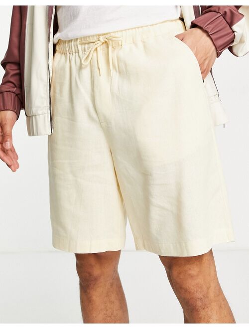 ASOS DESIGN linen boxy shorts in pastel yellow