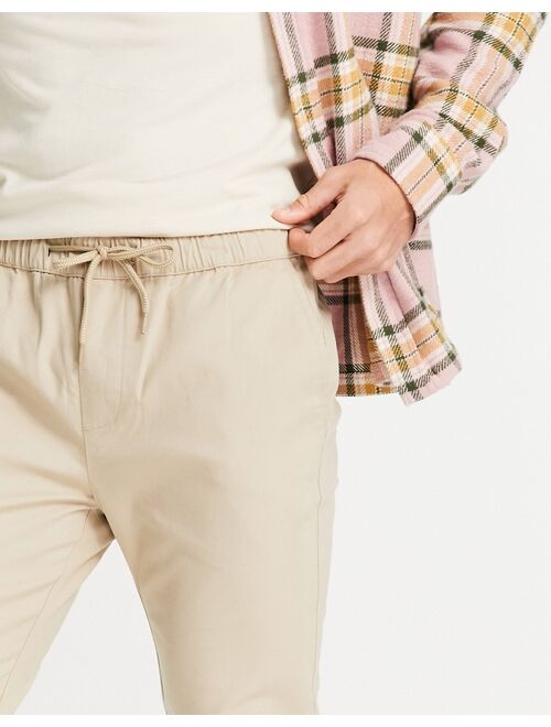 ASOS DESIGN skinny chinos with elasticated waist in beige