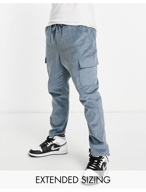 ASOS DESIGN tapered fit cargo pants in cord in blue