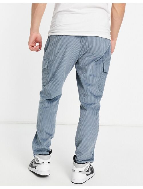 ASOS DESIGN tapered fit cargo pants in cord in blue