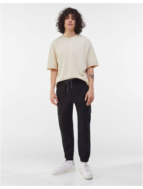 Bershka belted cargo pants in black