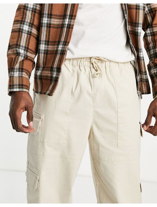 ASOS DESIGN oversized tapered cargo pants in beige