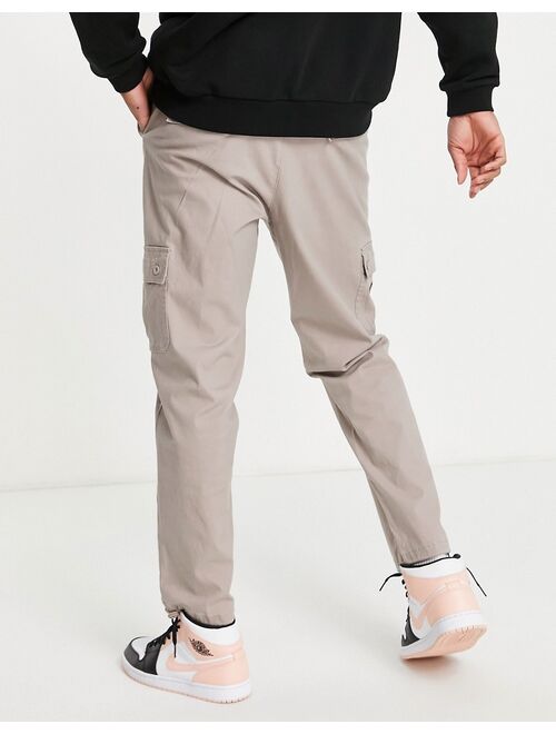 ASOS DESIGN tapered cargo pants in brown