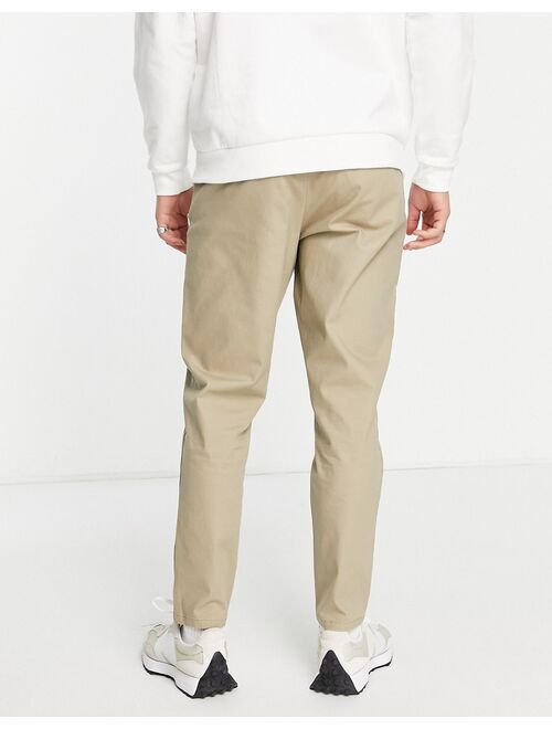 ASOS DESIGN tapered chinos in light khaki