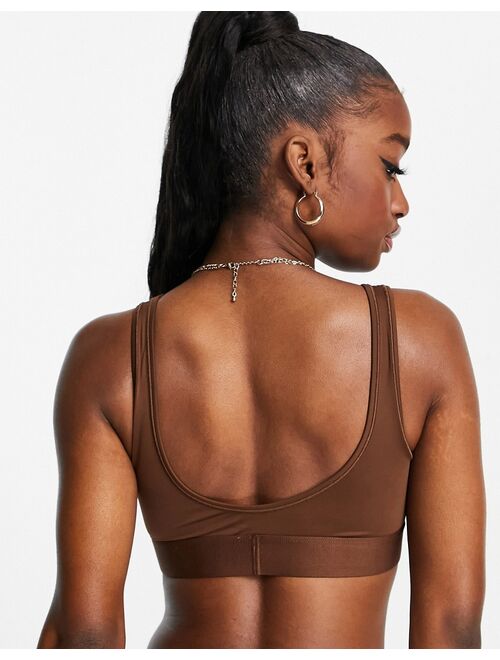 Calvin Klein Circle Of Women recycled microfiber cropped bralette in umber